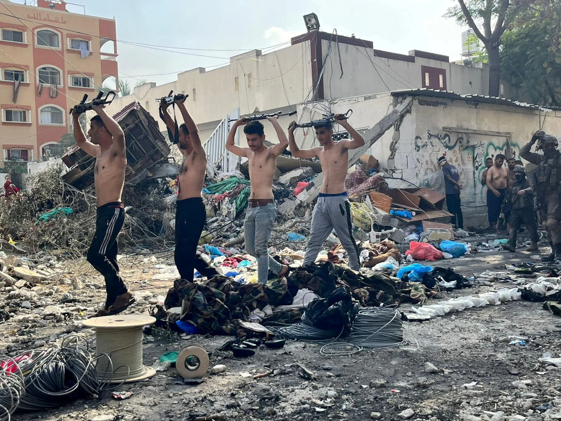 Hamas terrorists surrendering in Gaza in December 2023. Photo: Reuters