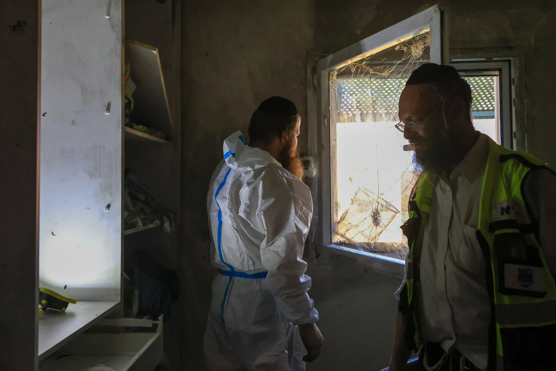 Zaka volunteers at home in Kibbutz Holit after the massacre. Photo: Reuters