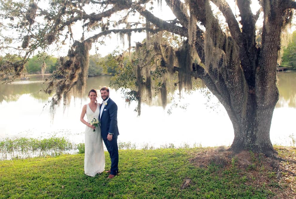Bride and groom by the lake