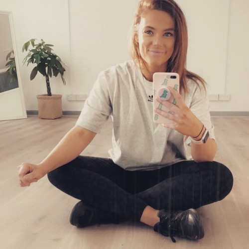 Client laughs with personal trainer