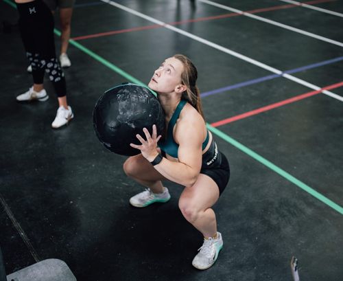 Client laughs with personal trainer