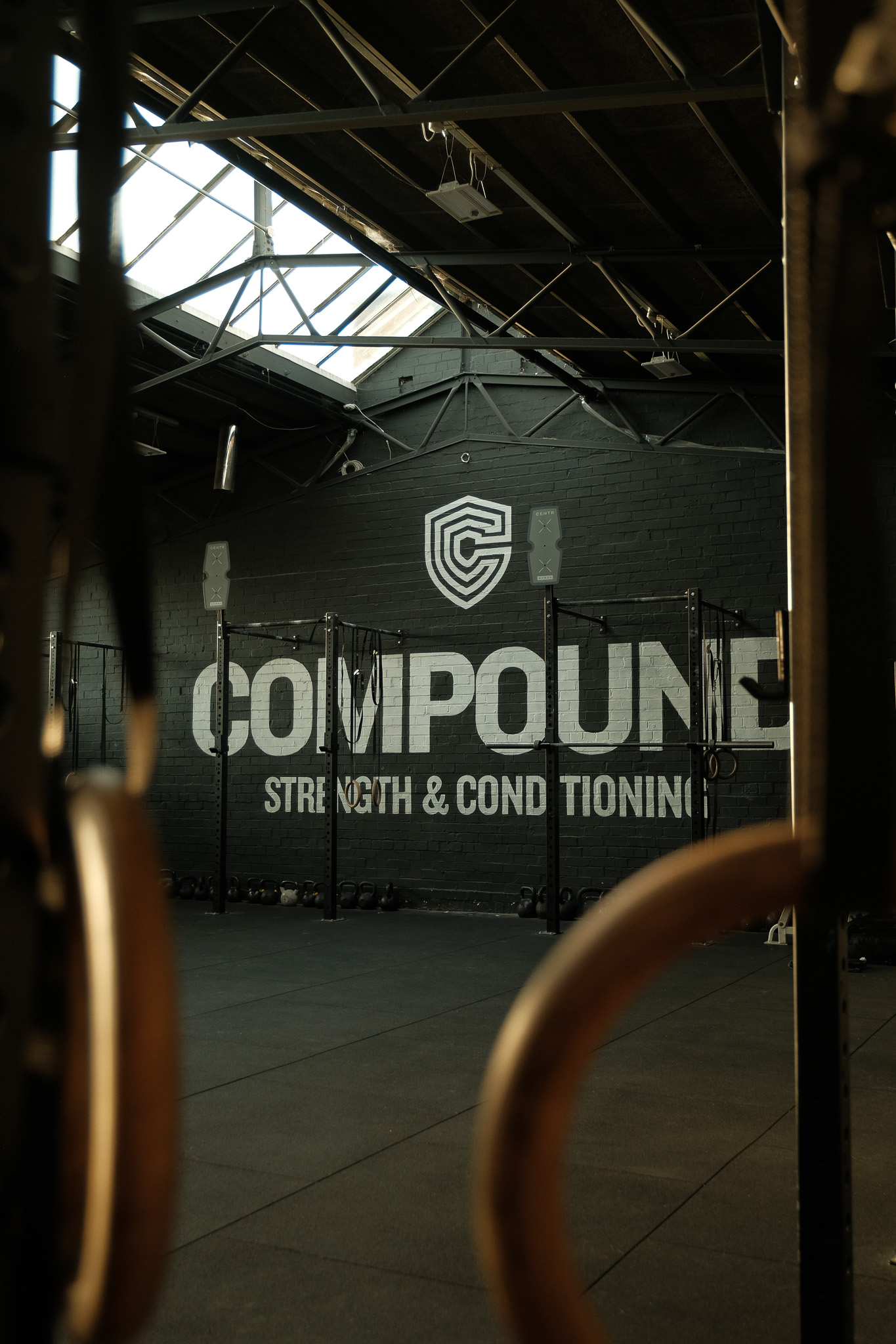 People training with kettlebells in gym