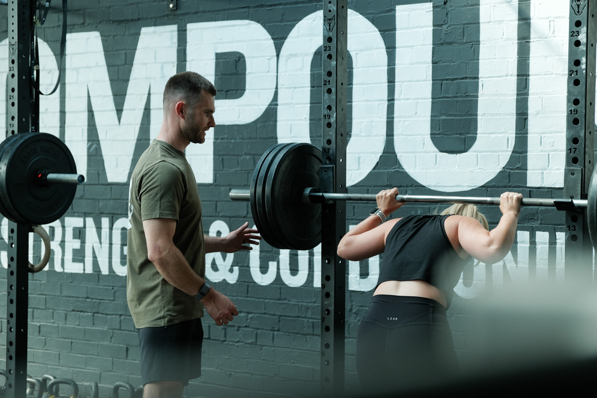 Client laughs with personal trainer