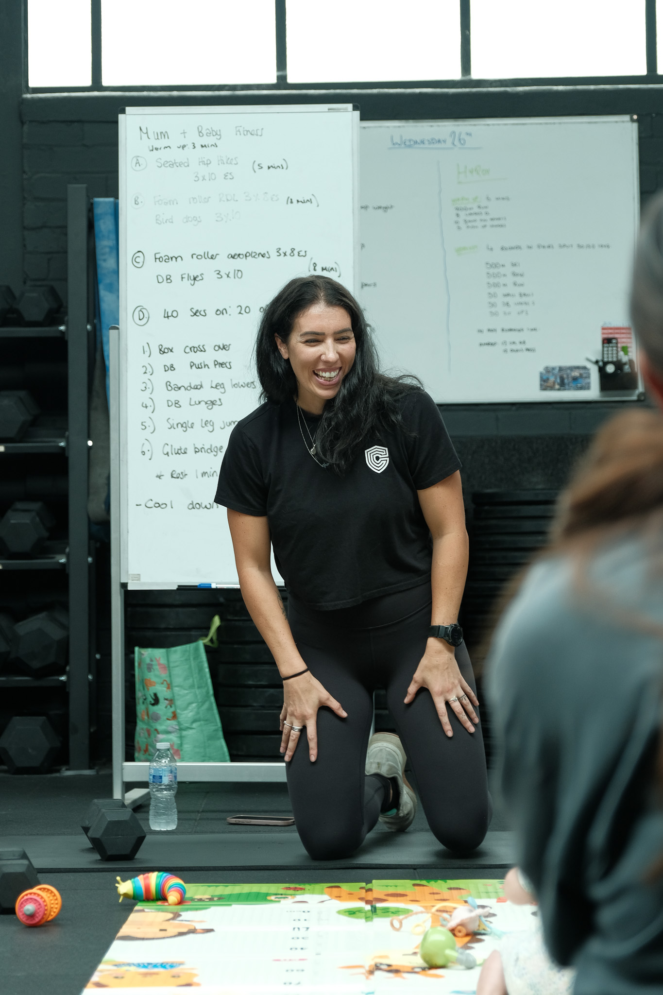 Client laughs with personal trainer 