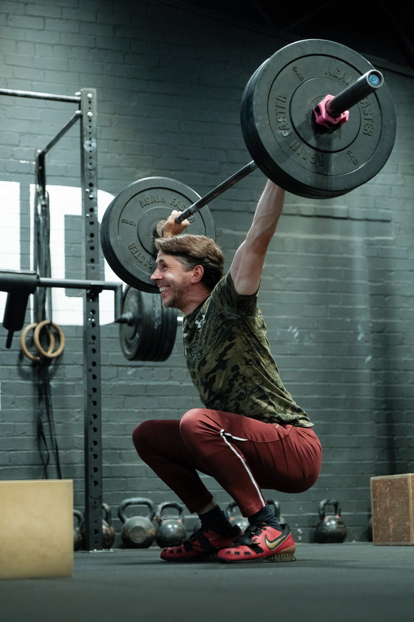 man training with barbell