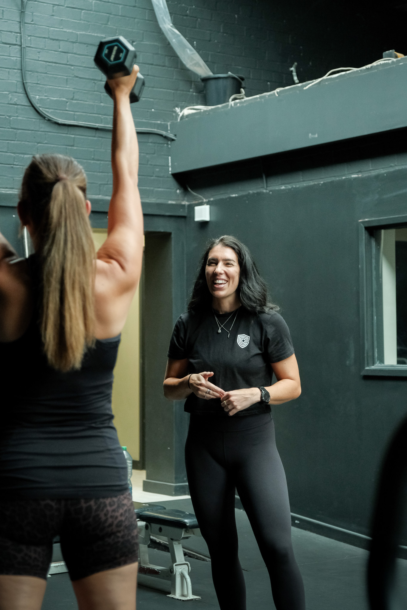Client laughs with personal trainer