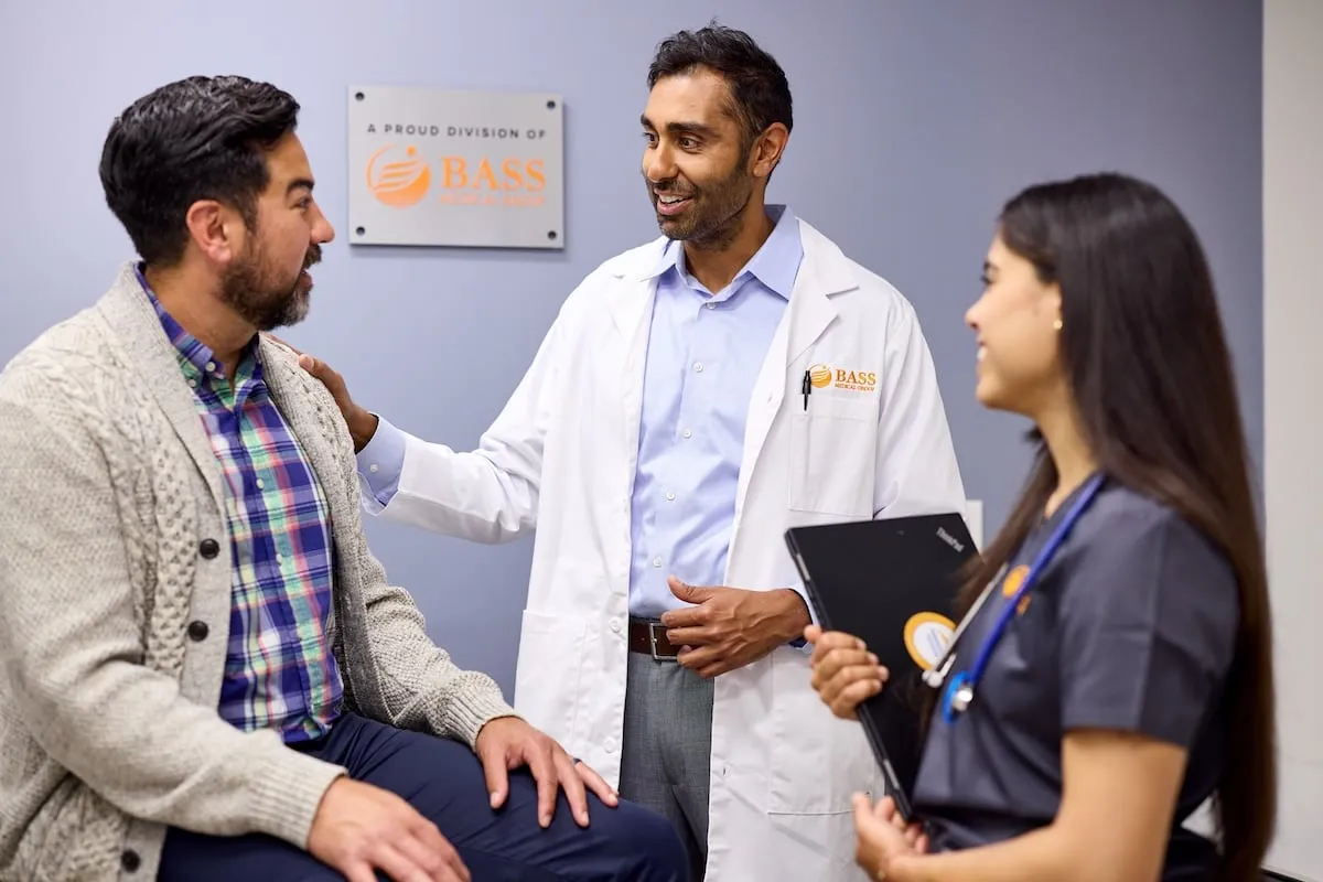 Doctor and Medical Assistant with Patient