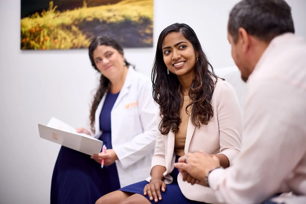 Dr. Danielle Bertoni and a male nurse provide compassionate support to a patient at Gregory Rhodes MD Cancer Center’s Support Services department.