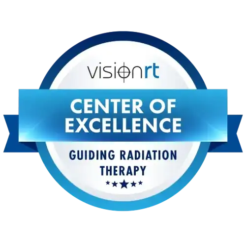 Vision RT Center of Excellence badge recognizing the Gregory Rhodes, MD Cancer Center for excellence in radiation therapy guidance.