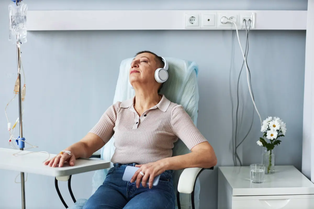 Patient relaxing comfortably during an infusion therapy session at the Gregory Rhodes MD Cancer Center in Walnut Creek, part of BASS Medical Group.