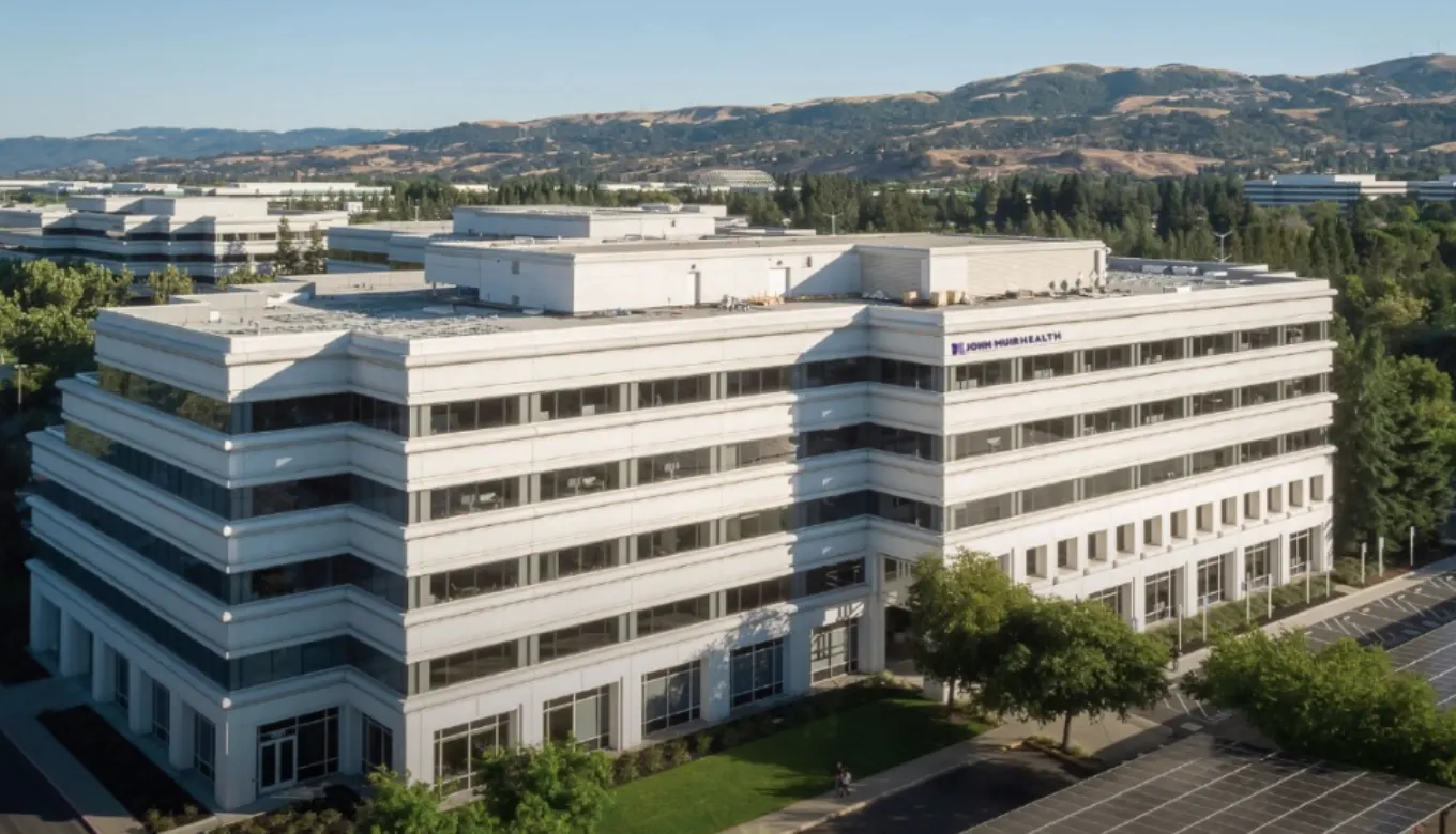 White, modern-looking John Muir Health building off of 12677 Alcosta Blvd in San Ramon, California.