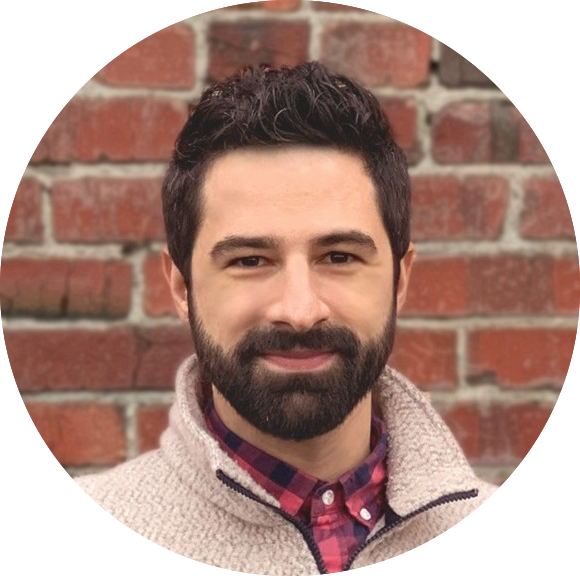 A picture of Josh Suhr in a collared shirt.