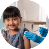 Young girl receiving a vaccination while giving a thumbs-up, symbolizing confidence and support for immunization.