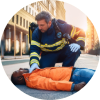 First responder assisting an unconscious person lying on a sidewalk, symbolizing emergency response to an opioid overdose.