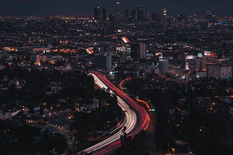 Long exposure photograph of a Los Angeles freeway at night.