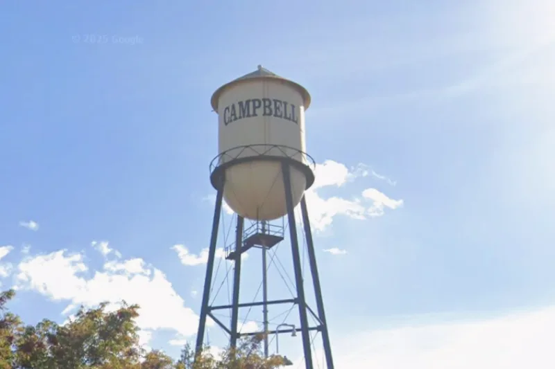 Water tower with the word CAMPBELL on it.