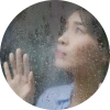 Person holding their forehead in discomfort on a rainy California day, showing sinus headache triggered by cold weather and barometric pressure changes.