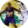 Phoenix Suns guard Eric Bledsoe drives to the basket against Dallas Mavericks forward Dorian Finney-Smith during a 2017 NBA game, symbolizing the intensity and physical strain of professional basketball.