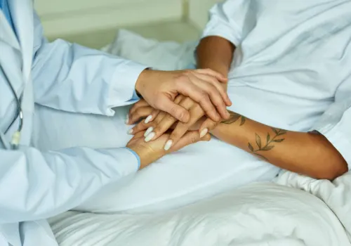 A compassionate OB-GYN physician comforting a woman after diagnosing an ectopic pregnancy, highlighting the importance of early detection and medical care.