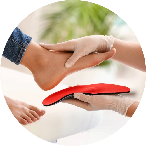 Podiatrist making insoles for a patient's flat feet.