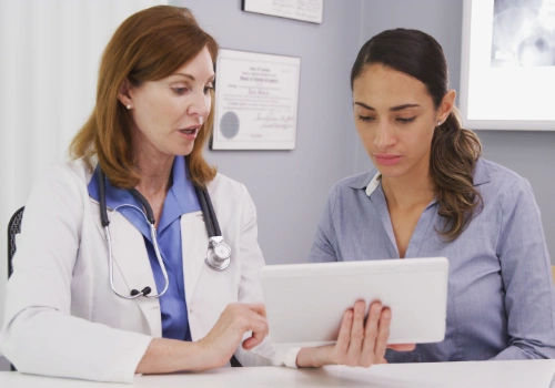 Female physician consulting with patient in California medical clinic.