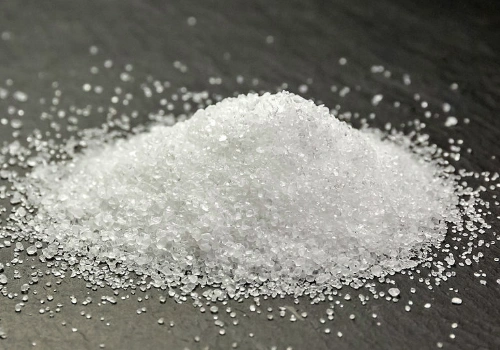 Close-up of granulated erythritol resembling white sugar crystals.
