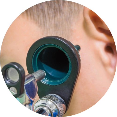Doctor using an otoscope to examine an infected ear