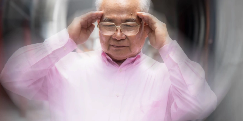 Older man feeling dizziness consistent with vertigo