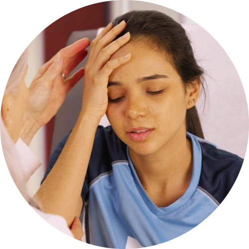Teen soccer player getting checked for a concussion