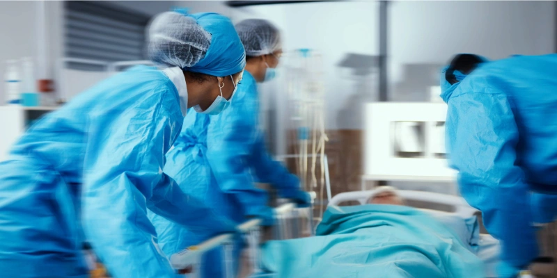 Patient with compartment syndrome being rushed into an operating room
