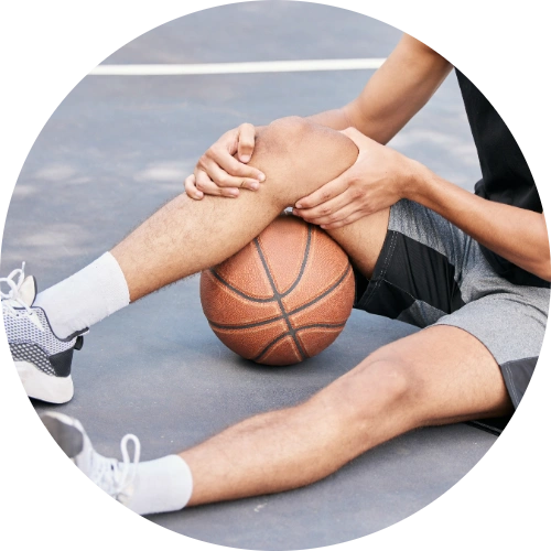 Basketball player holding his unstable knee in discomfort