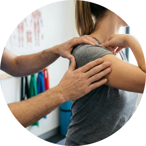 Physical therapist examining a female athlete's shoulder for a rotator cuff injury