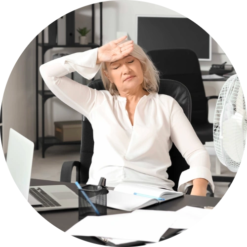 Woman experiencing hot flashes associated with menopause