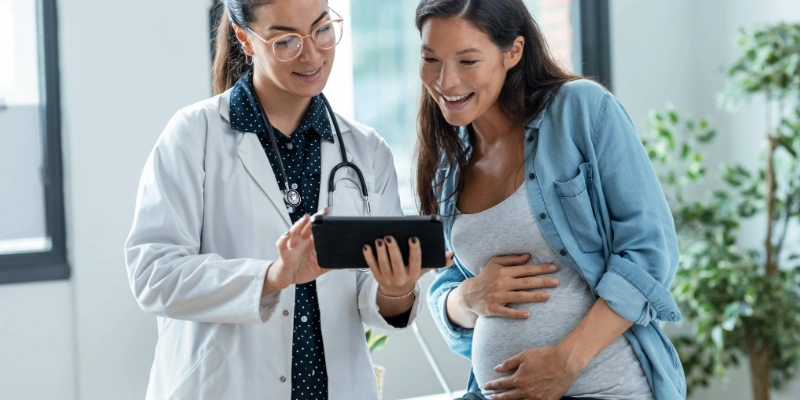 Pregnant patient receiving prenatal care during a checkup