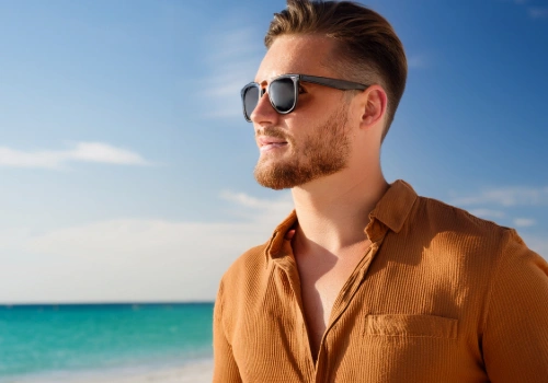 Man wearing sunglasses on a beach