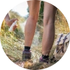Woman applying insect repellent before hiking to help prevent tick bites
