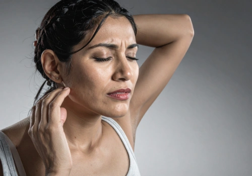 Adult experiencing a headache caused by neck pain and muscle tension