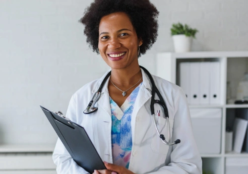 Black female doctor holding a clipboard