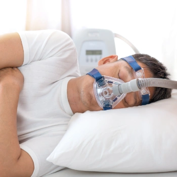 Man with CPAP machine mask to help his sleep apnea
