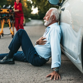 Man suffering a heart attack in the parking lot