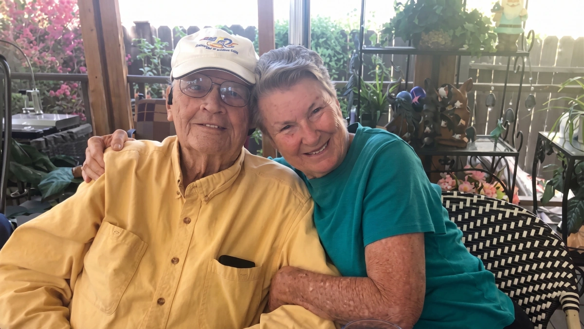 Pancreatic cancer survivor smiling with his partner after completing MRI-guided radiation therapy.