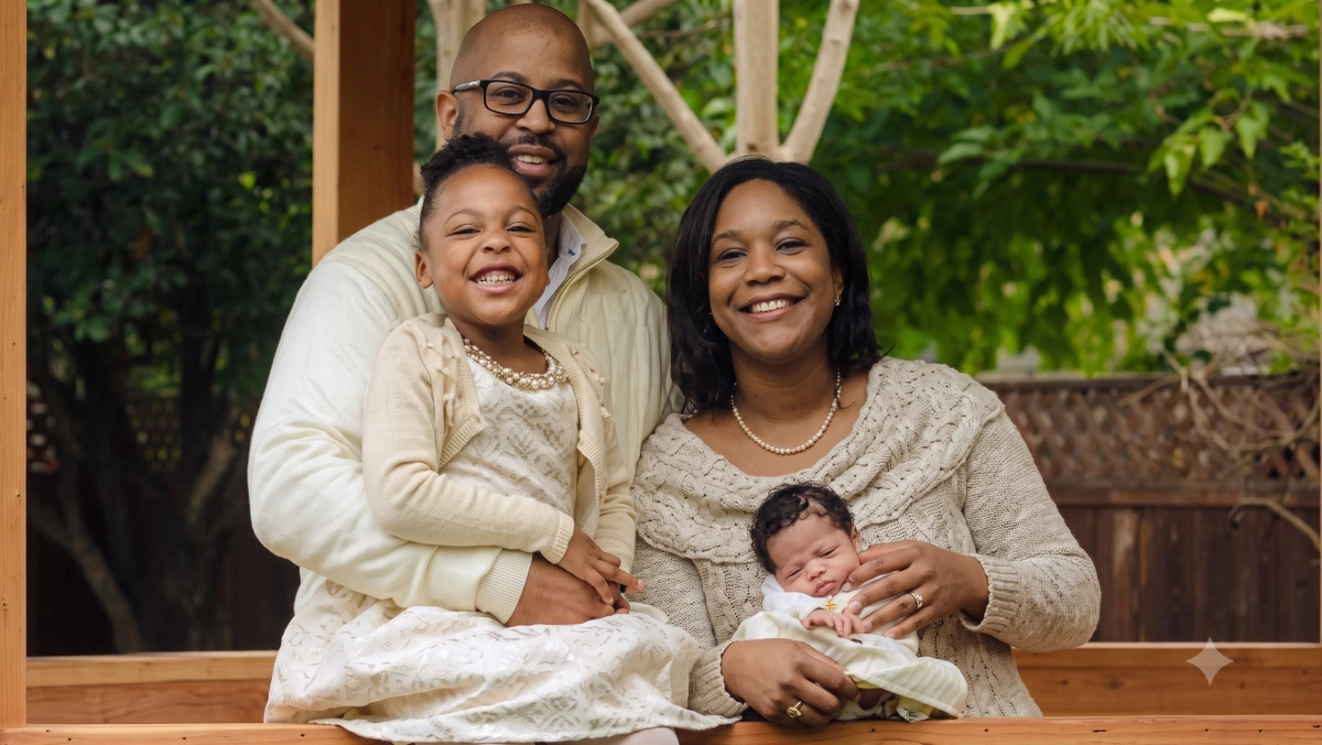 Adina smiles with her family in their backyard, reflecting their support and unity throughout her breast cancer journey.