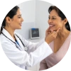 Woman discussing menopause-related oral health concerns with a healthcare provider