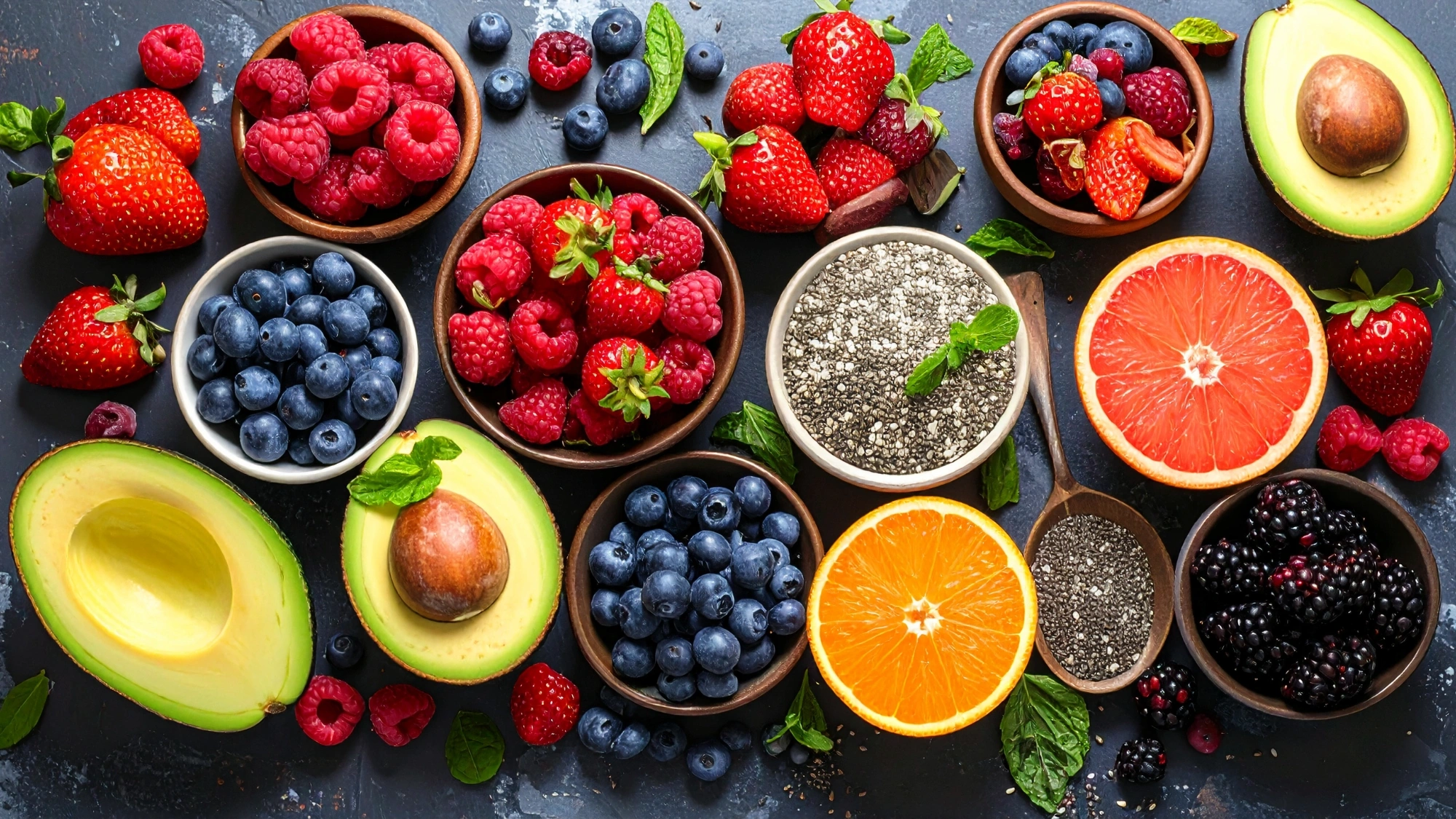 Array of healthy foods like chia seeds and berries