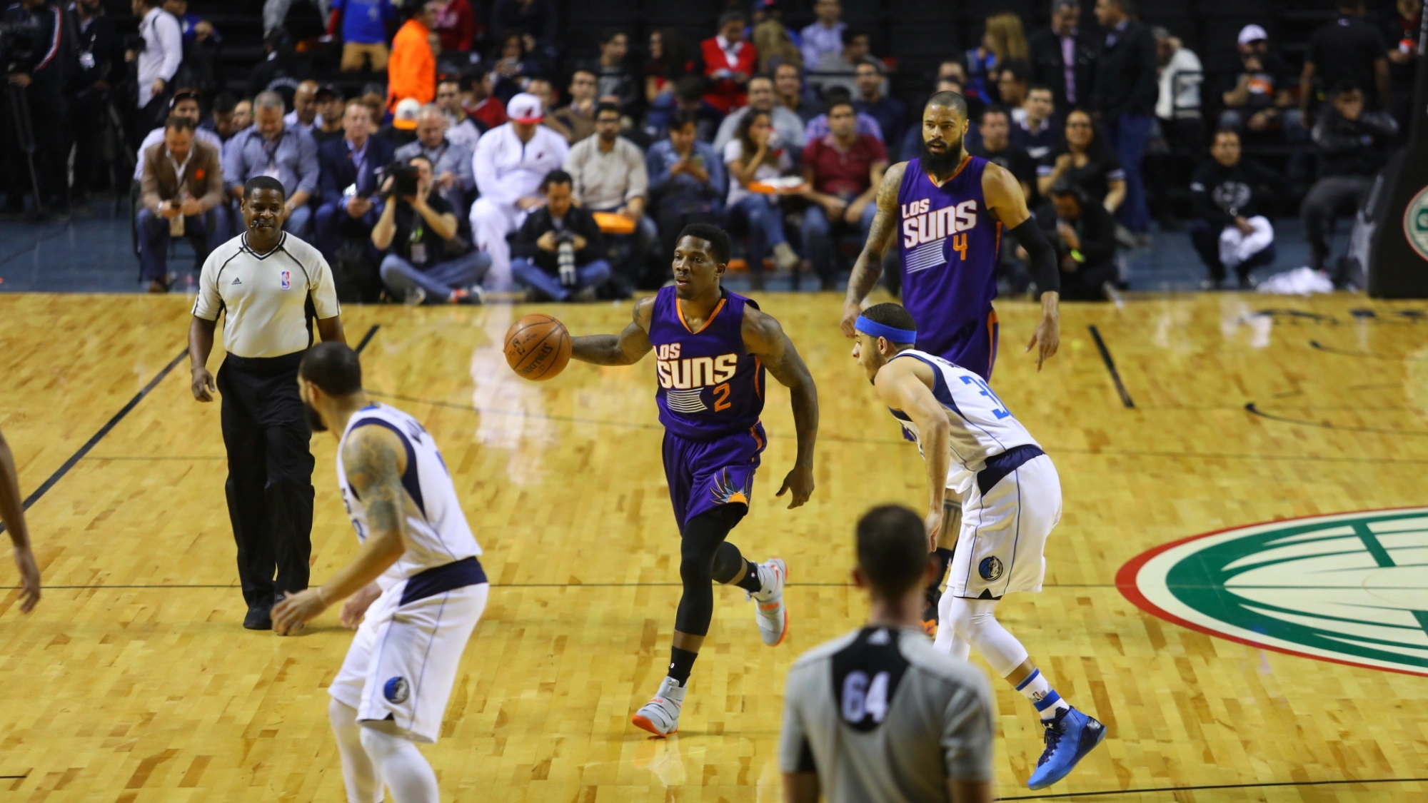 Phoenix Suns guard Eric Bledsoe drives to the basket against Dallas Mavericks forward Dorian Finney-Smith during a 2017 NBA game.