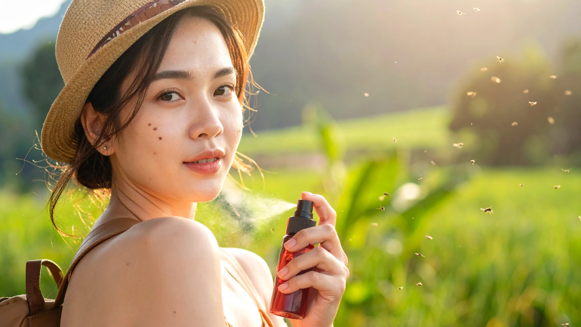 Traveler applying insect repellent to help prevent mosquito bites while abroad.