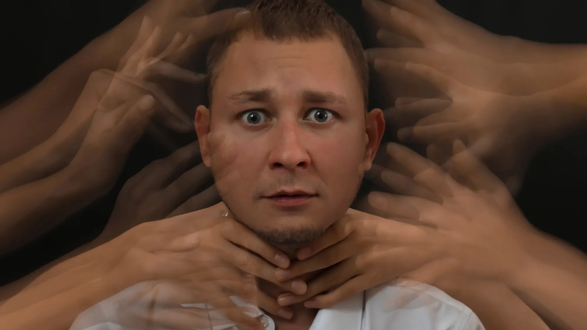 Psychosis-ridden man hallucinating hands around him