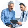 Man discussing enlarged prostate symptoms and treatment options with a urologist