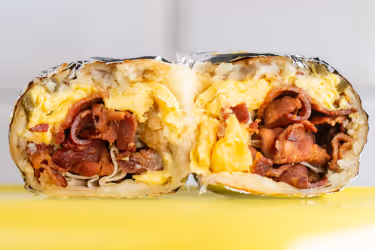 Breakfast burrito with bacon and eggs