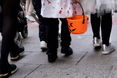 People wearing Halloween costumes and snickers